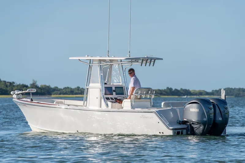 Slide: The Image of 2023 Stuart 27 Center Console boat on water with dual Yamaha engines. - 8