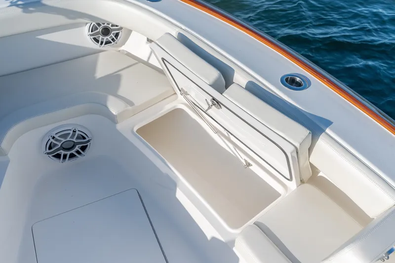 Slide: The Image of 2023 Stuart 27 Center Console boat interior with open storage compartment. - 29