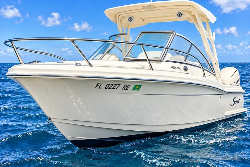 Slide: The Image of 2015 Scout 245 Dorado boat cruising on clear blue ocean waters. - 1