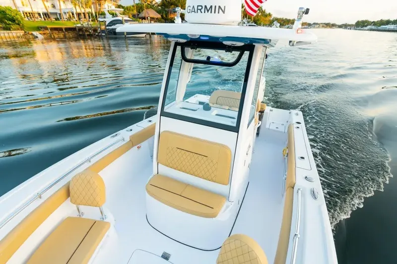 Slide: The Image of 2027 Sportsman Open 212 Center Console boat cruising on calm waters. - 7