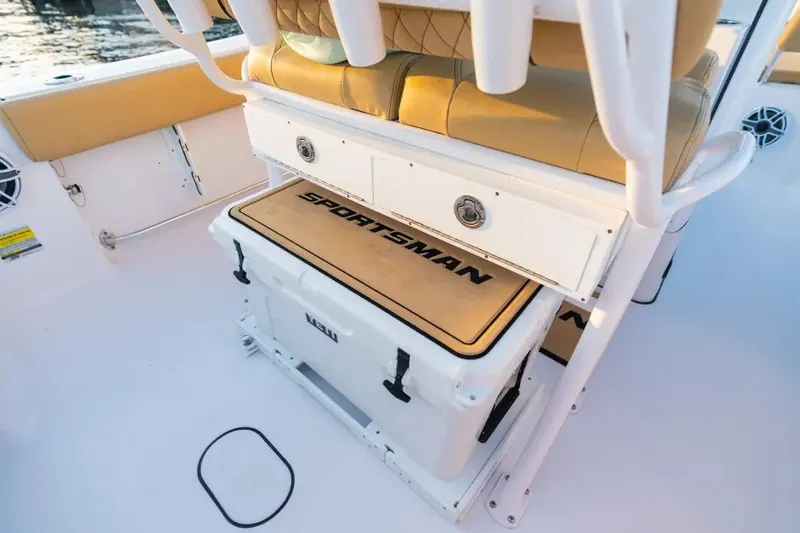Slide: The Image of 2027 Sportsman Open 212 Center Console boat interior with cushioned seating and storage. - 3