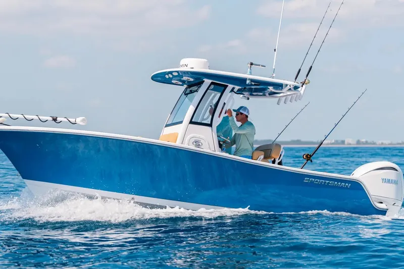 The Image of 2027 Sportsman Open 212 Center Console boat cruising on the ocean with fishing rods. - 0