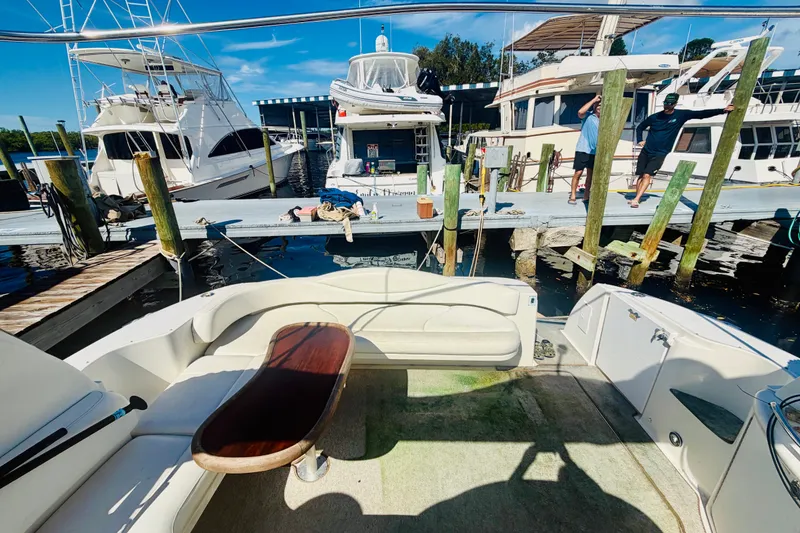 Slide: The Image of 2000 Sea Ray 410 Sundancer docked at marina with people on pier. - 32
