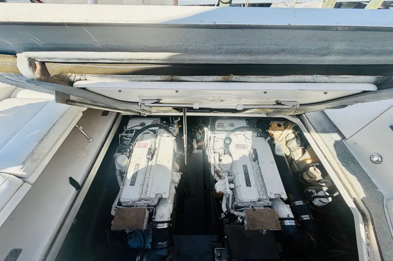 Slide: The Image of Engine compartment of a 2000 Sea Ray 410 Sundancer, showcasing dual engines. - 49