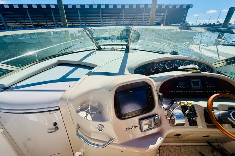 Slide: The Image of Cockpit view of 2000 Sea Ray 410 Sundancer yacht with navigation instruments. - 45