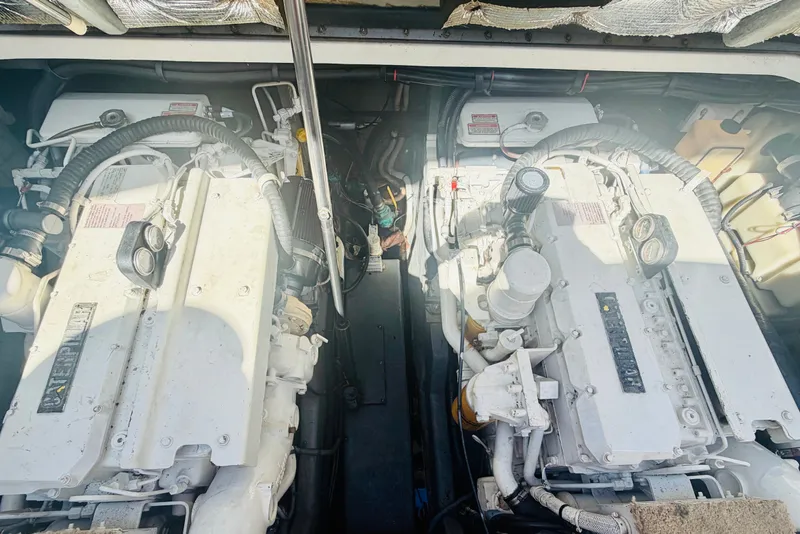 Slide: The Image of Engine room of a 2000 Sea Ray 410 Sundancer with dual engines. - 55