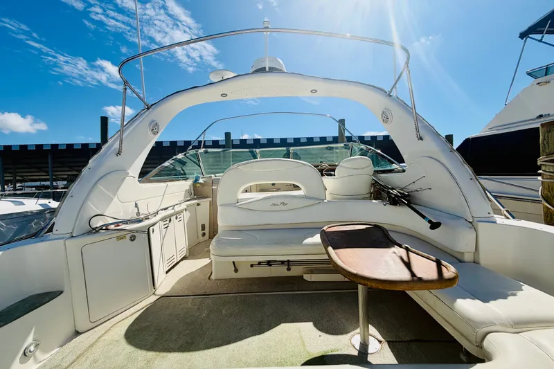 Slide: The Image of Interior view of a 2000 Sea Ray 410 Sundancer yacht under a clear blue sky. - 10