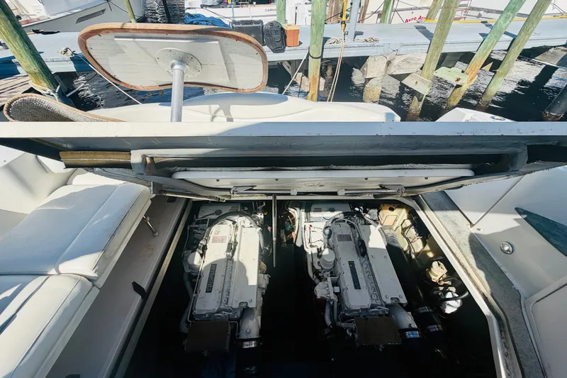 Slide: The Image of Engine compartment of a 2000 Sea Ray 410 Sundancer at a dock. - 48
