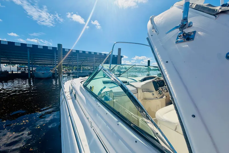 Slide: The Image of 2000 Sea Ray 410 Sundancer yacht docked under sunny skies. - 20