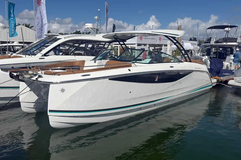 The Image of 2027 Jeanneau TH33 luxury yacht docked at a marina under clear skies. - 0