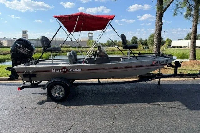 The Image of 2019 Tracker Bass Tracker Classic XL boat with red canopy on trailer. - 0