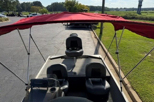 Slide: The Image of 2019 Tracker Bass Tracker Classic XL with red canopy on a sunny day. - 17