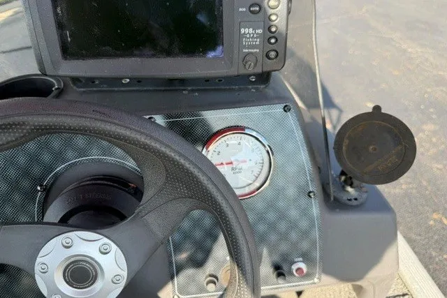 Slide: The Image of Dashboard of 2019 Tracker Bass Tracker Classic XL boat with steering wheel and gauges. - 13