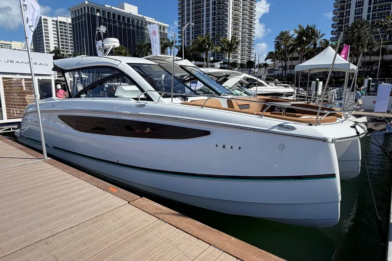 The Image of 2027 Jeanneau TH38 luxury yacht docked at marina, showcasing sleek design and modern features. - 0