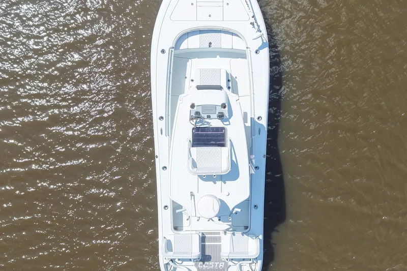 Slide: The Image of Aerial view of 2024 Costa Custom Boats 264HC on calm water. - 20