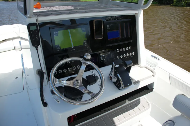 Slide: The Image of 2024 Costa Custom Boats 264HC helm with advanced navigation and control systems. - 32