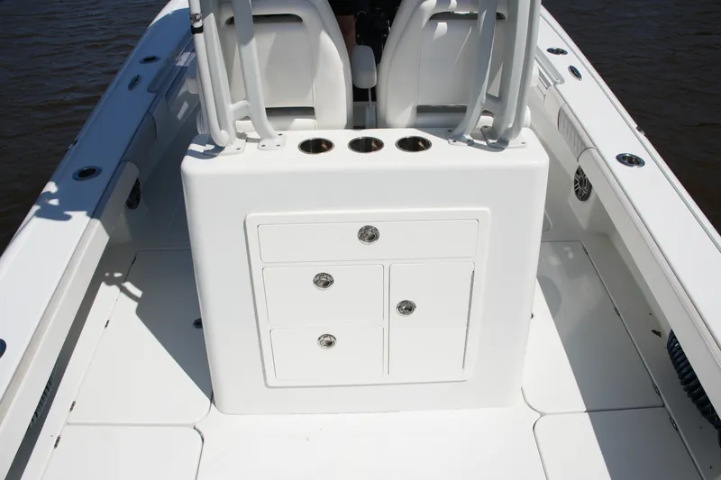 Slide: The Image of 2024 Costa Custom Boats 264HC deck with storage compartments and cup holders. - 46