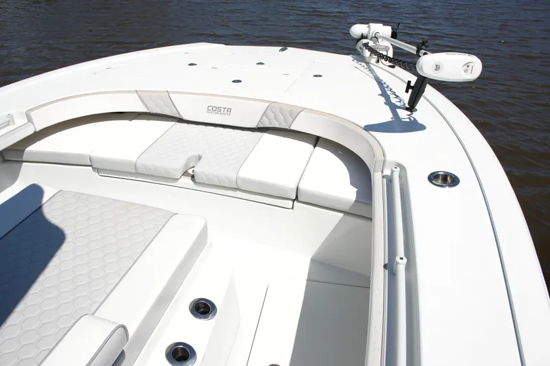 Slide: The Image of 2024 Costa Custom Boats 264HC, white deck with seating, on calm water. - 22