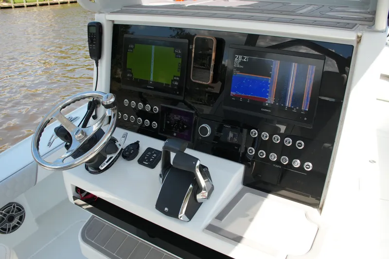 Slide: The Image of 2024 Costa Custom Boats 264HC helm with advanced navigation and control systems. - 56