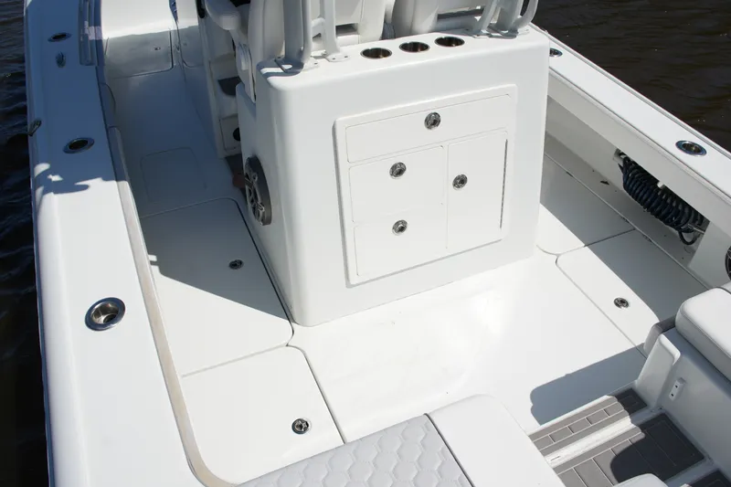 Slide: The Image of 2024 Costa Custom Boats 264HC deck with seating and storage compartments. - 48