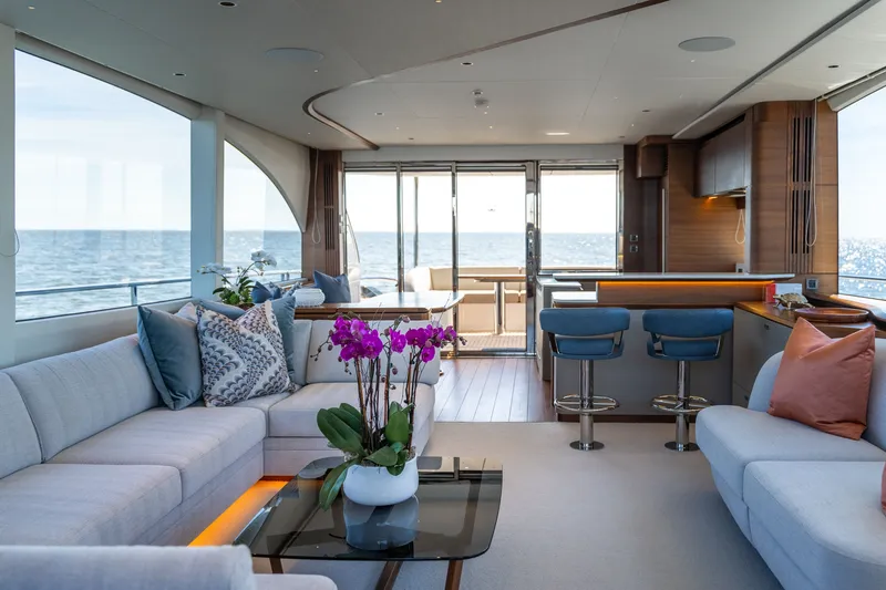 Slide: The Image of Luxurious salon of the Princess Y72 with modern furnishings, large windows, and ocean view. - 17