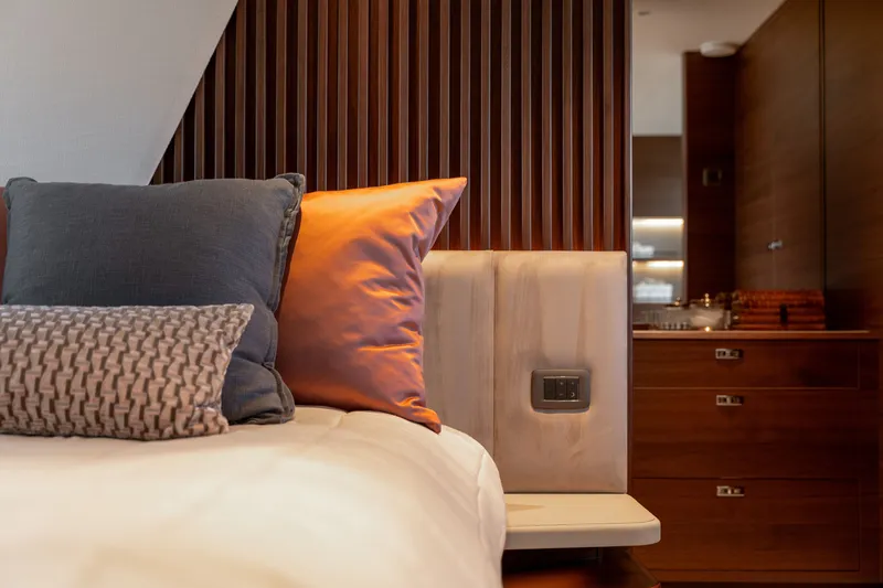 Slide: The Image of Luxurious bedroom with elegant pillows and wooden walls on a Princess Y72 yacht. - 37