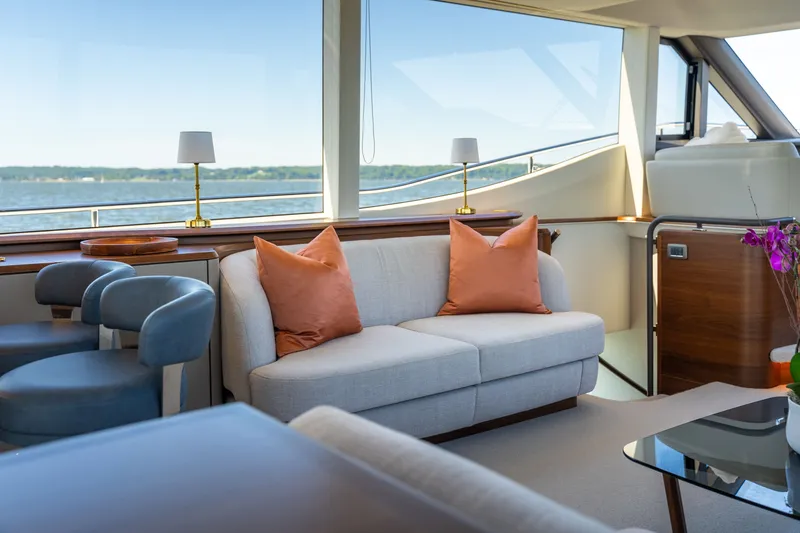 Slide: The Image of Luxurious salon of the Princess Y72 with comfortable sofas and a view of the water. - 21