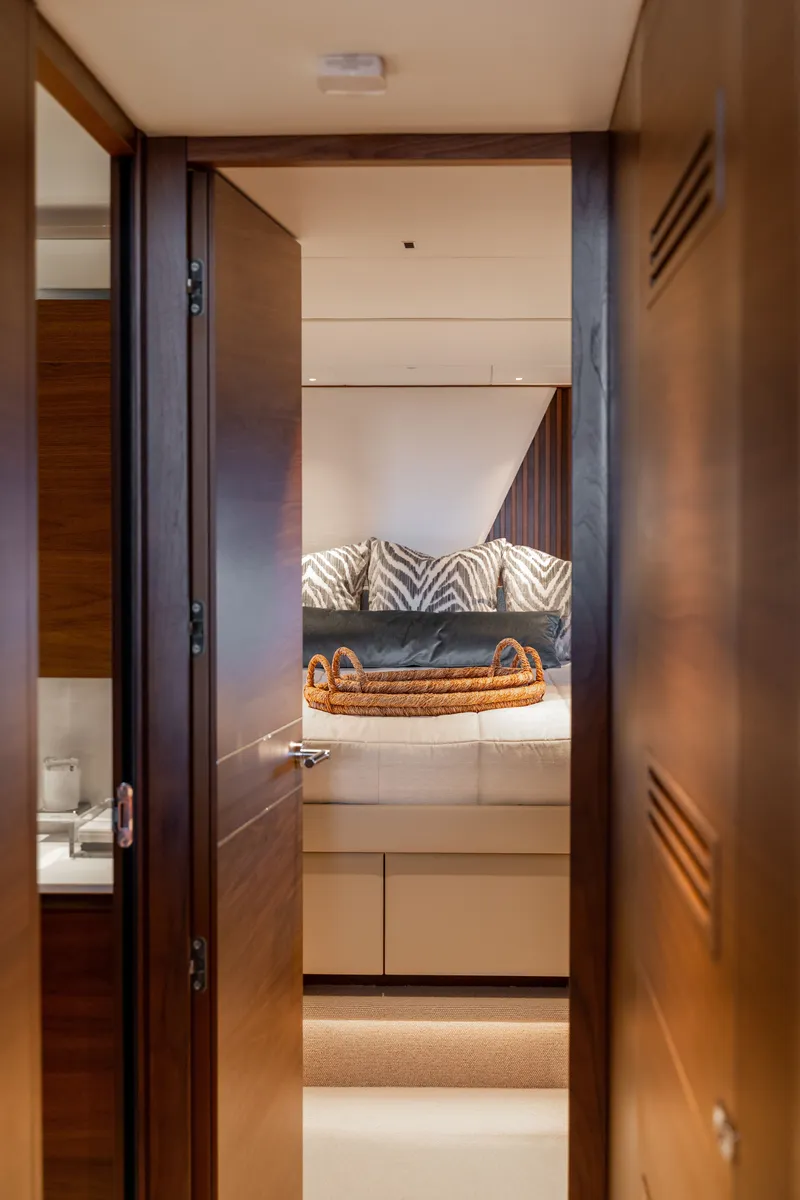 Slide: The Image of A luxurious yacht bedroom with a large bed and stylish decor. - 46