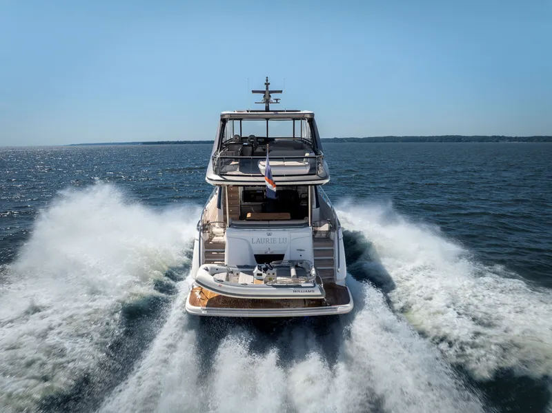 Slide: The Image of The 2025 Princess Y72 speeds across the water, with a clear view of the stern. - 6