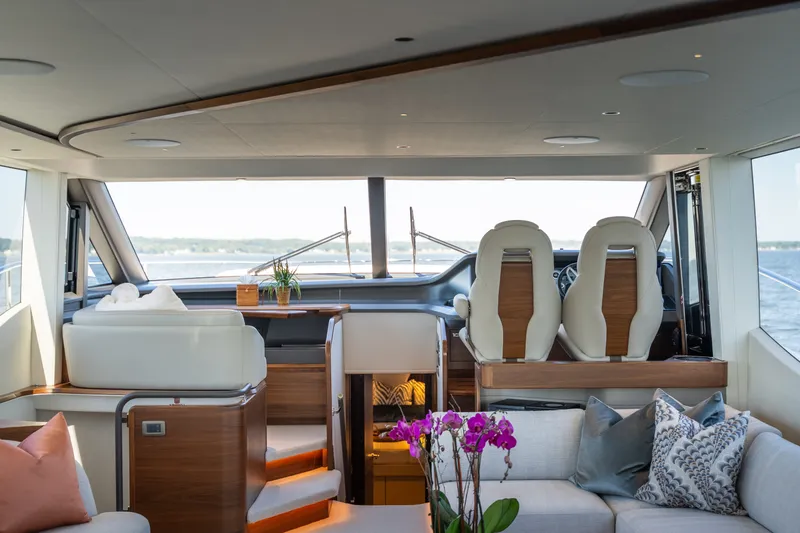 Slide: The Image of Luxurious yacht salon with modern seating, large windows, and elegant decor. - 23