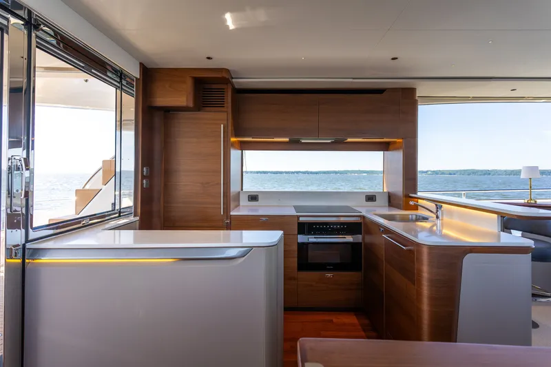 Slide: The Image of Modern yacht kitchen with wood paneling and sea view. - 11
