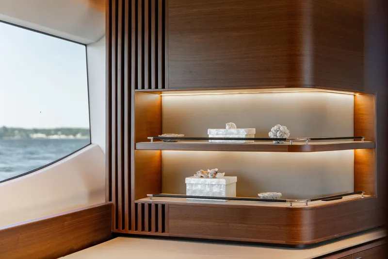 Slide: The Image of Elegant shelving with lighting and decorative items in a luxurious yacht. - 40