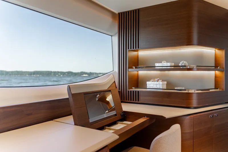 Slide: The Image of Elegant interior of the Princess Y72 yacht with wood paneling and large windows overlooking the water. - 38