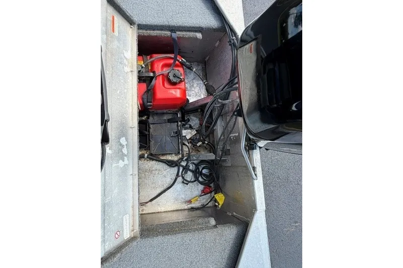 Slide: The Image of 2019 Tracker Bass Tracker Classic XL boat engine compartment with red fuel tank and wiring. - 15