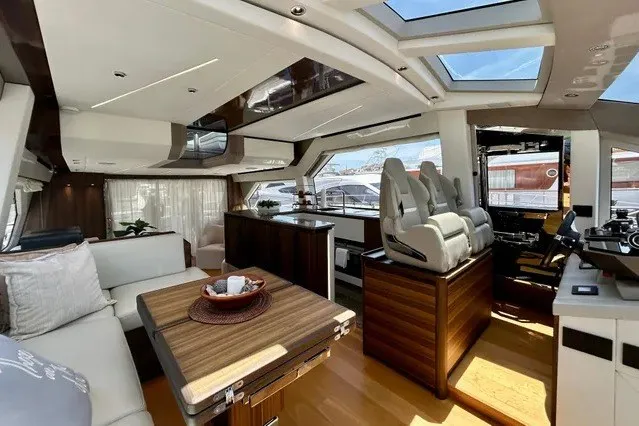 Slide: The Image of Luxurious 2024 Aicon 66 yacht interior with modern seating, dining area, and panoramic windows. - 31