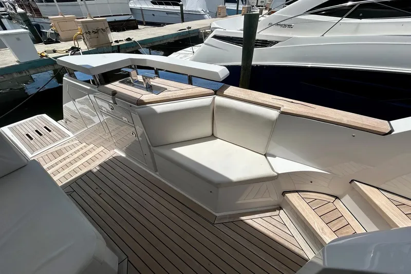 Slide: The Image of Luxurious 2024 Aicon 66 yacht deck with elegant seating and wooden flooring. - 29
