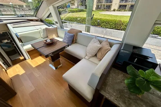 Slide: The Image of Luxurious 2024 Aicon 66 yacht interior with elegant seating, wooden flooring, and modern decor. - 22