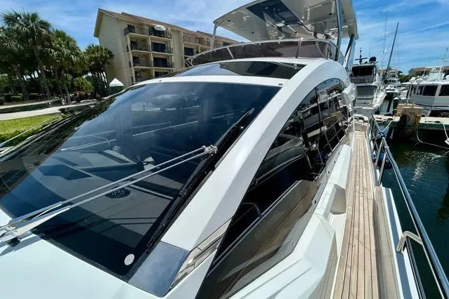 Slide: The Image of Luxurious 2024 Aicon 66 yacht docked at marina, showcasing sleek design and modern features. - 26