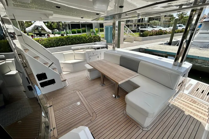 Slide: The Image of Luxurious 2024 Aicon 66 yacht interior with elegant seating and wooden flooring. - 33