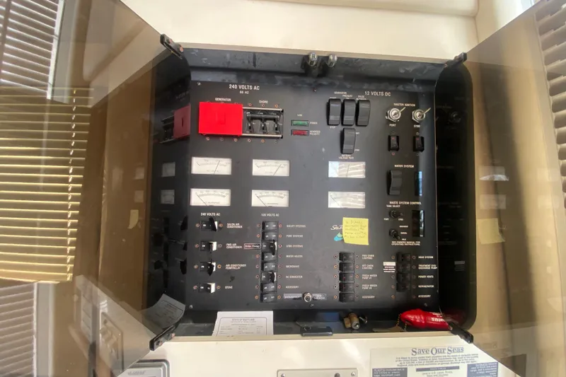 Slide: The Image of Electrical control panel on a 1996 Sea Ray 440 Express Bridge yacht. - 34