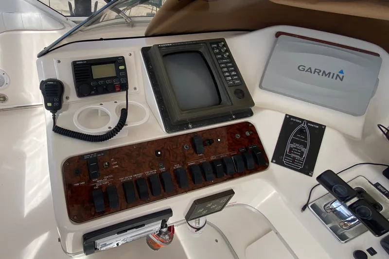 Slide: The Image of Control panel of a 1996 Sea Ray 440 Express Bridge with Garmin and Furuno electronics. - 39