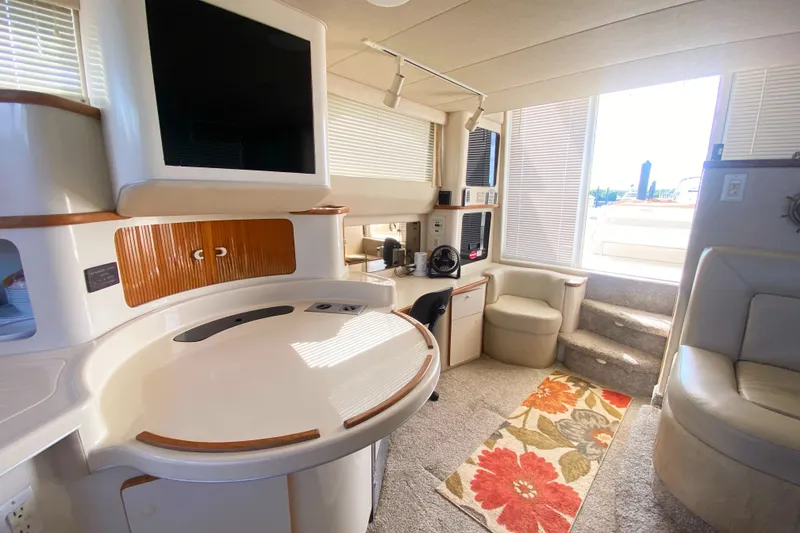 Slide: The Image of Interior of 1996 Sea Ray 440 Express Bridge yacht with modern amenities and stylish decor. - 16