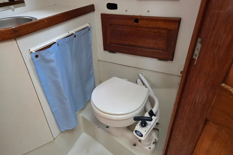 Slide: The Image of 1978 Bristol 35.5 yacht bathroom with marine toilet and wooden cabinetry. - 21