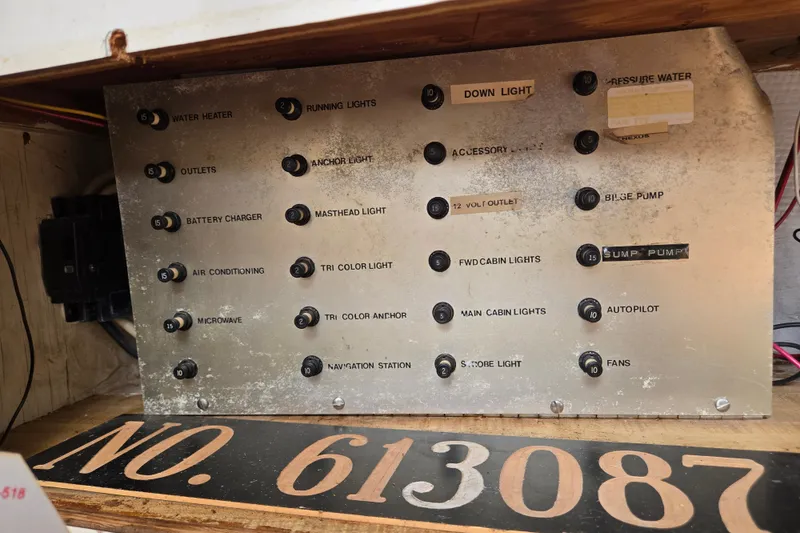 Slide: The Image of Electrical control panel on a 1978 Bristol 35.5 boat, featuring various labeled switches. - 16