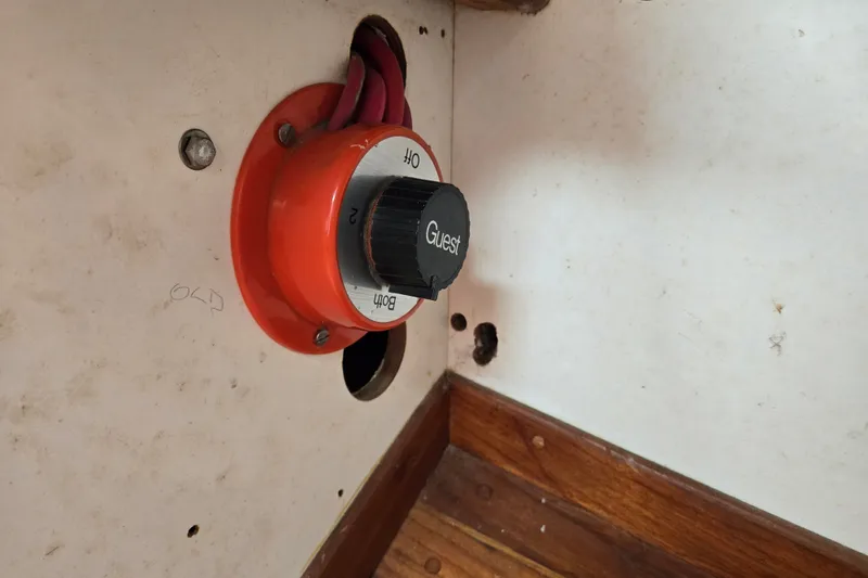 Slide: The Image of Battery switch on a 1978 Bristol 35.5 boat, featuring "Guest" label and wiring. - 31