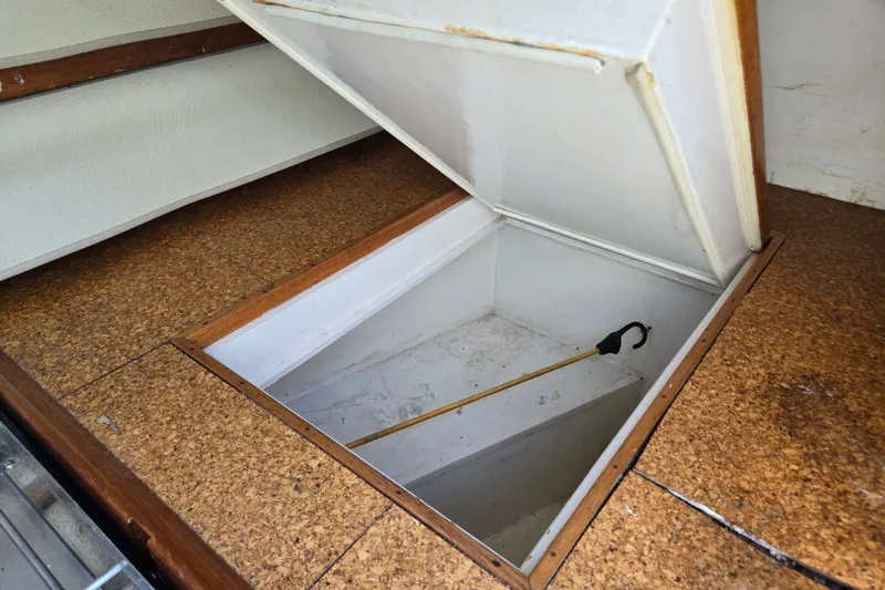 Slide: The Image of Open storage compartment on 1978 Bristol 35.5 boat with cork flooring. - 26