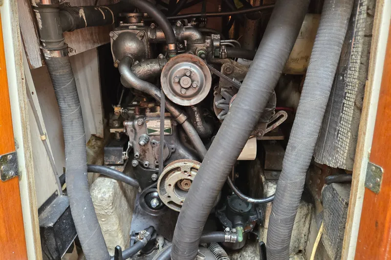 Slide: The Image of 1978 Bristol 35.5 engine compartment with visible hoses and mechanical components. - 32