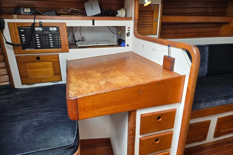 Slide: The Image of 1978 Bristol 35.5 yacht interior with wooden navigation desk and control panel. - 14