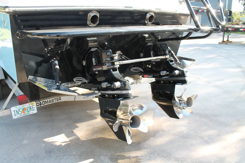 Slide: The Image of 2018 Lightning 38 Center Console boat with dual Mercury MerCruiser engines and stainless steel propellers. - 22