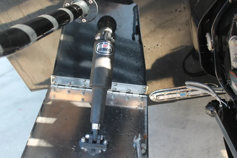 Slide: The Image of Close-up of Lenco trim tab on 2018 Lightning 38 Center Console boat. - 25